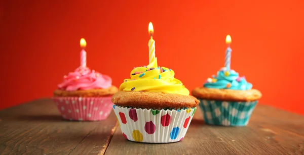 Three cupcake with candles — Stock Photo, Image
