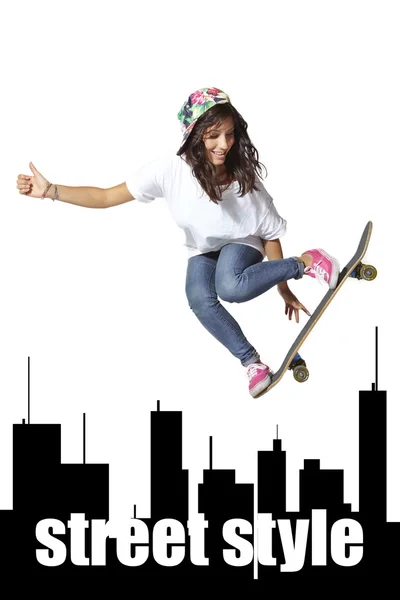 Skateboarder woman jumping isolated on white showing thumbs up — Stock Photo, Image