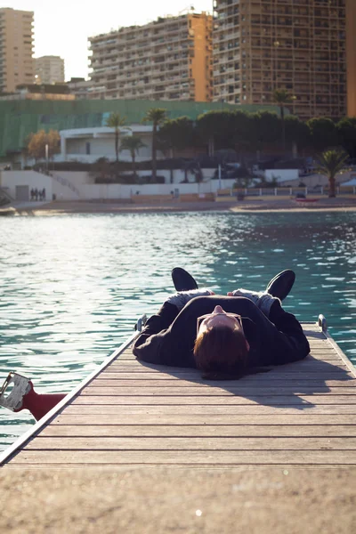 Woman Lying On A Pier — Stock Photo, Image