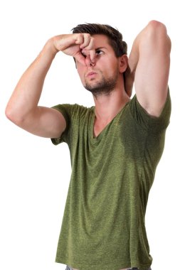 Man sweating very badly under armpit and pointing there clipart