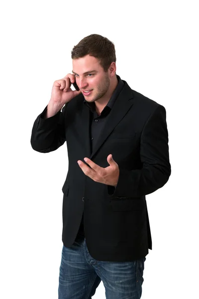 若いジャケットの男性の携帯電話で話しています。 — ストック写真