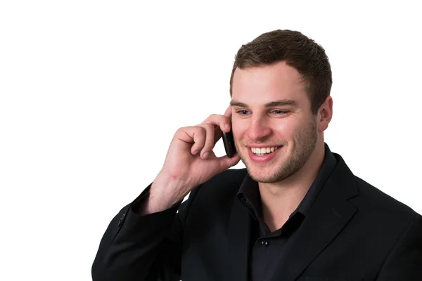 Молодий чоловік в куртці розмовляє по телефону — стокове фото