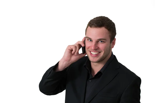 Mladý muž v bundě mluví po telefonu — Stock fotografie