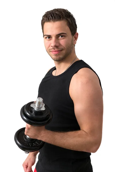 Joven atractivo haciendo ejercicio con pesas — Foto de Stock