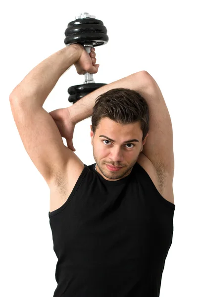Attraktiver junger Mann trainiert mit Gewichten — Stockfoto
