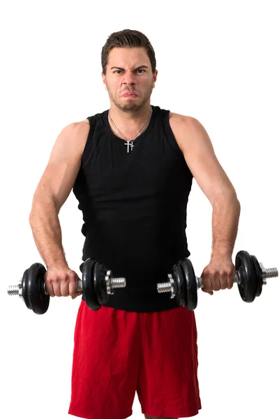 Joven atractivo haciendo ejercicio con pesas —  Fotos de Stock