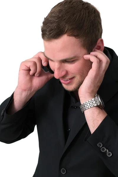 Młody człowiek w kurtka rozmawia przez telefon — Zdjęcie stockowe