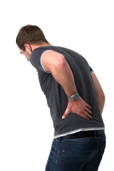 Молодой человек с болью в спине — стоковое фото