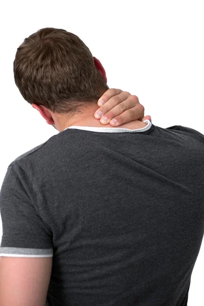 Молодой человек с болью в шее — стоковое фото