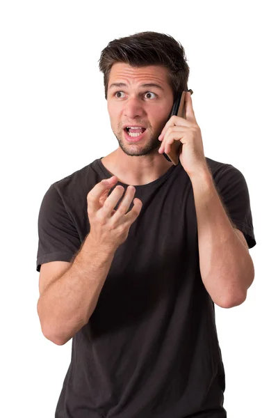 Velmi rozhněvaný mladý muž mluvit o telefonu Stock Obrázky
