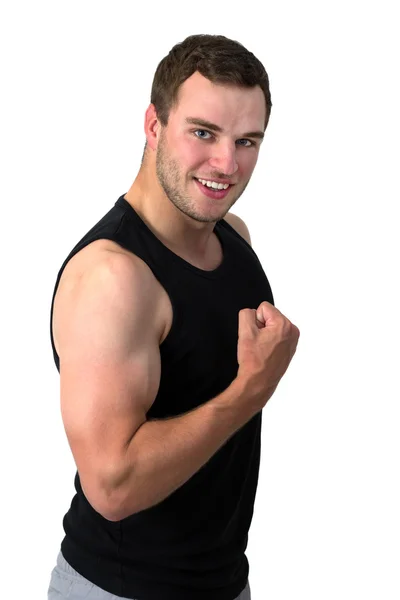 Jovem atraente homem flexionando seu bíceps — Fotografia de Stock