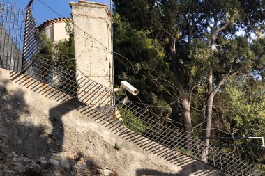 Surveillance Camera on a stone wall clipart