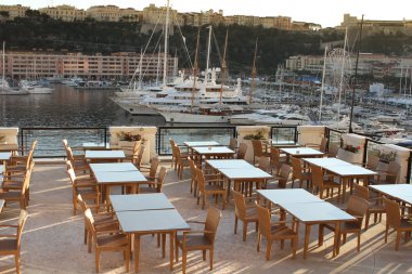 Restaurant at the harbor of monaco clipart