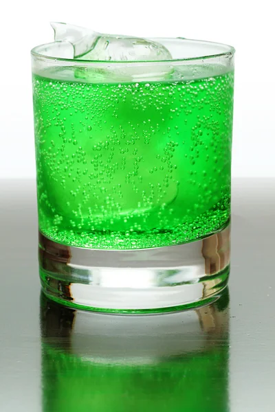 Green fizzy drink with ice cubes. — Stock Photo, Image