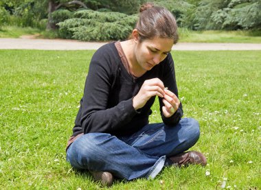 Young woman plucking the daisy clipart