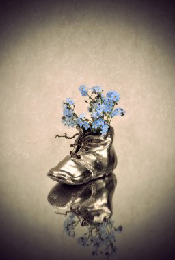 Antique vase with blue flowers clipart