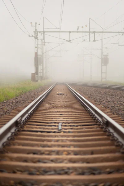 Railroad in fog — Stock Photo, Image