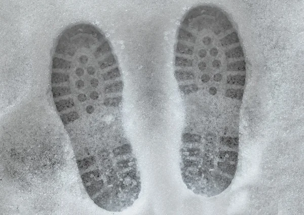 Shoeprints in melting snow — Stock Photo, Image