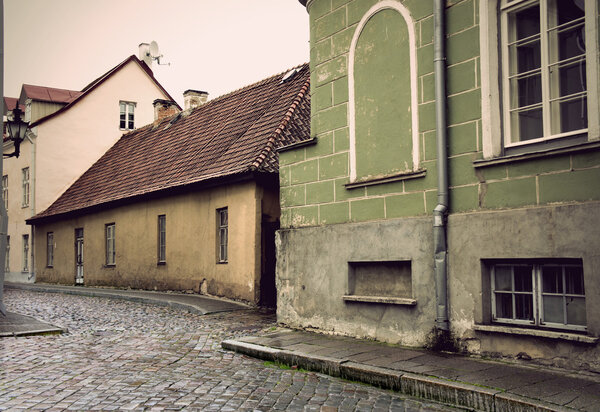 Narrow street with cobblestones in the old town of Tallinn, Estonia