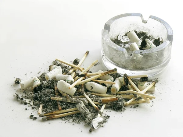 Smoked cigarettes,ash,matches and ash-tray — Stock Photo, Image