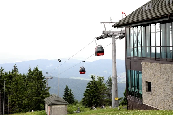 stock image red cars of rope line railway and station on top of Jaworzyna mountain near Krynica