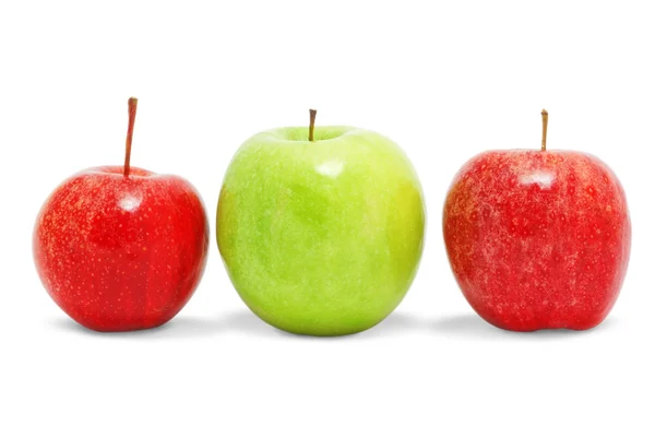 stock image Two red and one green apple. On a white background.