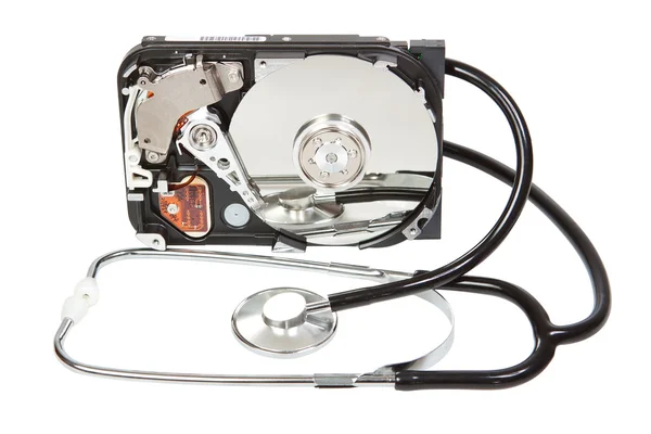 Reflected in the hard disk, a stethoscope. Diagnostic. — Stock Photo, Image