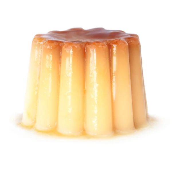 A delicious pudding with caramel on a white background. — Photo