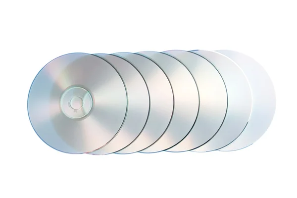 Grupo de closeup compacto disco óptico em um fundo branco. — Fotografia de Stock