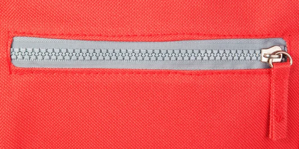 Zipper on a red background. Fastener. — Stock Photo, Image