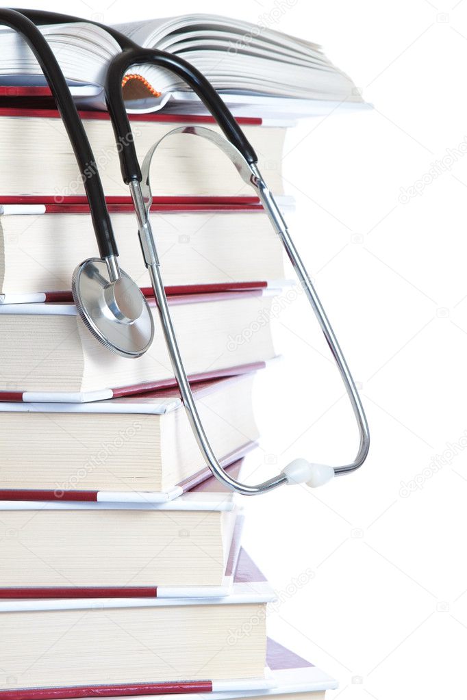 Stack of books and a stethoscope medical on a white background.