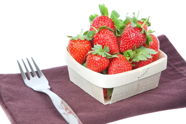 The composition of strawberries in a basket and a fork. On a whi — Stock Photo, Image