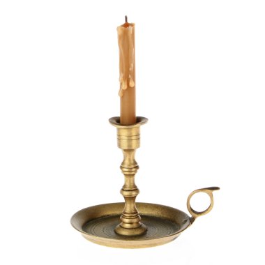 Candle on the old brass candlesticks on a white background. clipart