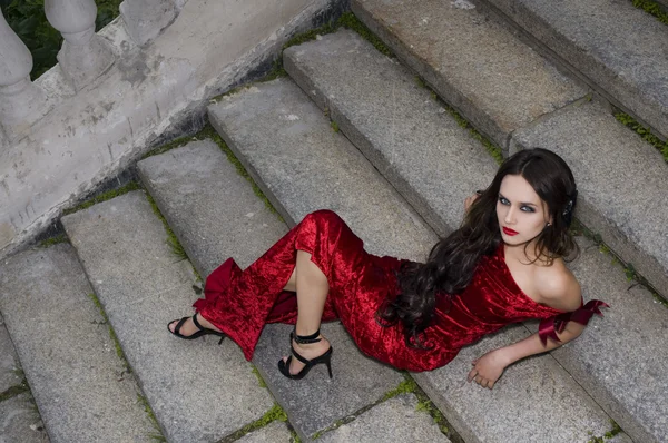 stock image Lady in red dress near private residence