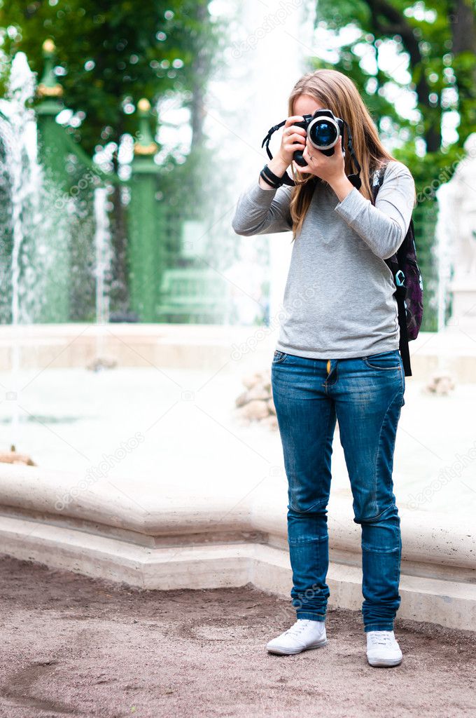 Girl taking photos during travel