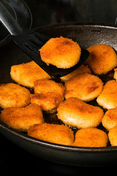 stock image Nuggets with one nugget on spatula