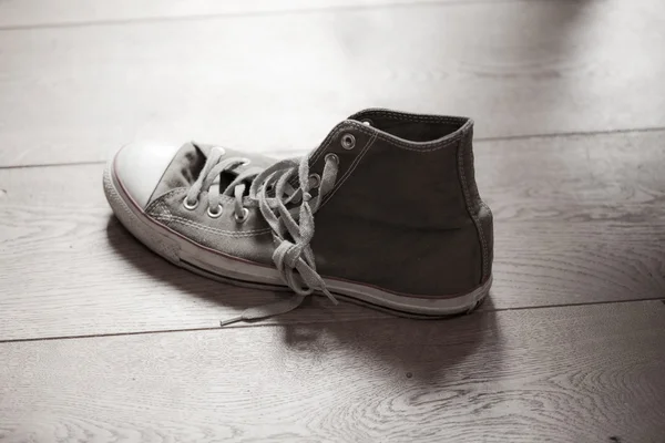 stock image High top sneakers on wood background