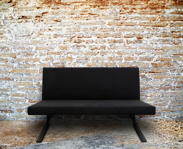Modern sofa in old brick wall room — Stock Photo, Image