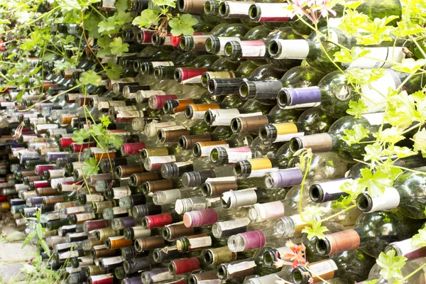 stock image Fence from of the empty bottles from a wine