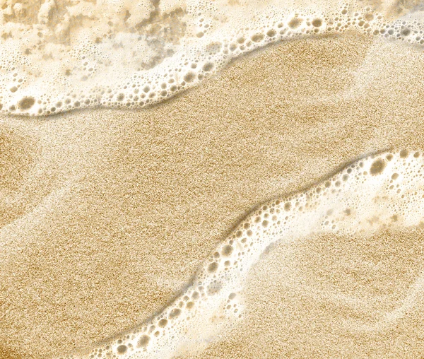 砂のビーチの水の背景 — ストック写真