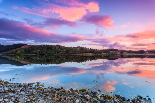 stock image Colorful sunrise at a lake