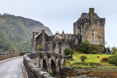 Bridge towards Eilan Donan castle in Scotland clipart