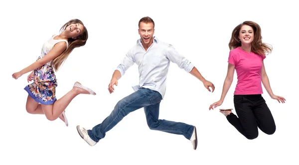 Group of happy young jumping — Stock Photo, Image