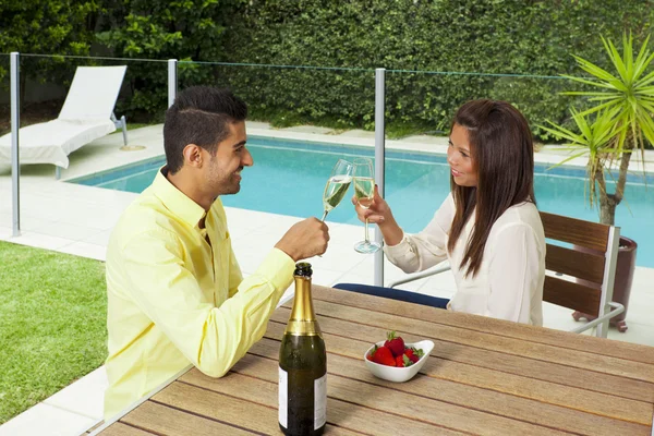 Young couple toasting with champagne — Stock Photo, Image