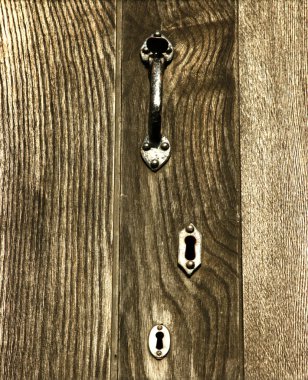 Wooden Door With Handle and Keyholes clipart