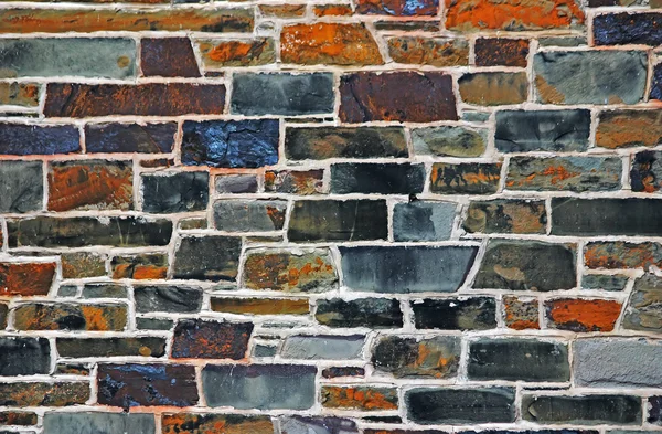 Colourful stones in wall — Stockfoto