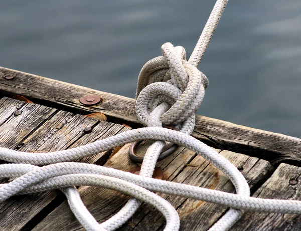 Knotted Rope Tied To Dock