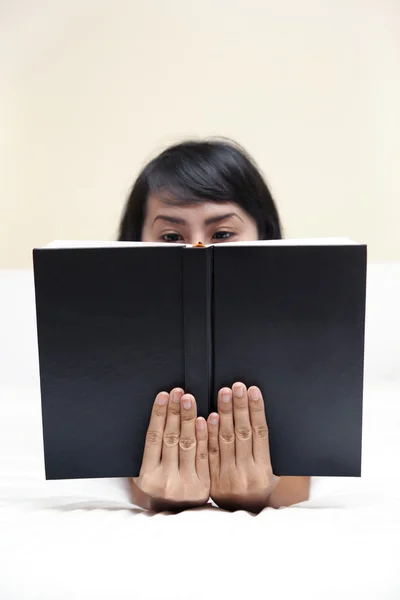 Woman reading a book seriously — Stock Photo, Image
