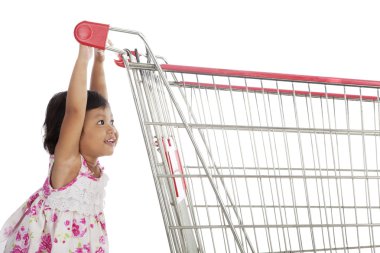 Cute Asian Girl Pushing Trolley clipart