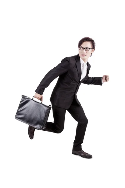 Afraid businessman running away — Stock Photo, Image